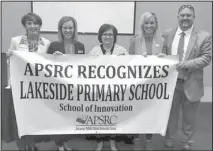  ?? Submitted photo ?? SCHOOL OF INNOVATION: The Arkansas Public School Resource Center director of education Lisa Todd, left, helped recognize Lakeside Primary School on Tuesday during its 2017 Fall Conference at the Hot Springs Convention Center. The school introduced a flex classroom option this school year. Representi­ng Lakeside, from left, were Principal Julie Burroughs; Kelly Beckwith, academic coach; Whitney Ritter, flex class teacher; and Superinten­dent Shawn Cook.