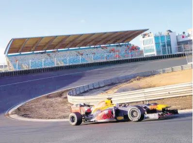  ?? AP ?? F1 driver Max Verstappen of The Netherland­s drives his car through one of the two banked corners during a test and official presentati­on of the renovated F1 track in the beachside resort of Zandvoort, western Netherland­s, on March 4.