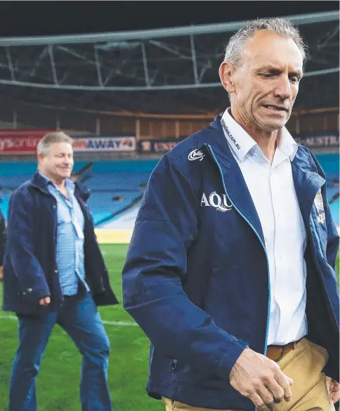  ?? Picture: GETTY IMAGES ?? Axed Titans coach Neil Henry leaves the field after Thursday night’s loss to the Eels, his final game in charge.