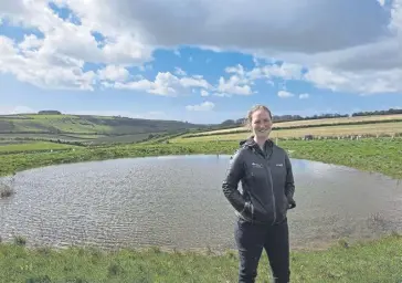  ?? ?? National Park Ranger Sophie Brown at a restored wildlife pond near Arundel