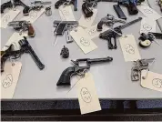  ?? Photo courtesy New Haven Police Department ?? Handguns surrendere­d to New Haven police in a gun buyback event and designated for destructio­n.