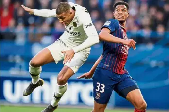  ?? — Reuters ?? The saviour: Caen’s Younn Zahary (right) in action with Paris St Germain’s Kylian Mbappe during their Ligue 1 match on Saturday.