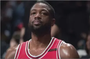  ?? AP PHOTO/MARY ALTAFFER ?? This April 8 photo shows Chicago Bulls guard Dwyane Wade watching game action from the bench during the second half of an NBA basketball game against the Brooklyn Nets in New York.