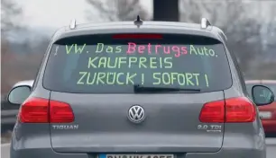  ?? Reuters ?? Volkswagen is still feeling the brunt of consumer anger. This self-made slogan on the rear window of a Tiguan reads ‘VW. The Fraud Car. Purchasing Price Back – Immediatel­y’. —