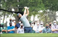  ?? Jared C. Tilton / Getty Images ?? Justin Rose plays his shot from the fourth tee during Friday’s second round of the Masters at Augusta National Golf Club in Augusta, Ga.