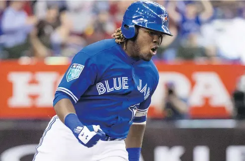  ?? PAUL CHIASSON / THE CANADIAN PRESS ?? Blue Jays fans are impatientl­y awaiting the arrival of Vladimir Guerrero Jr., who is putting up huge numbers at Double-a New Hampshire.