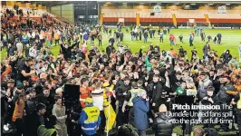  ?? ?? Pitch invasion The Dundee United fans spill onto the park at full-time