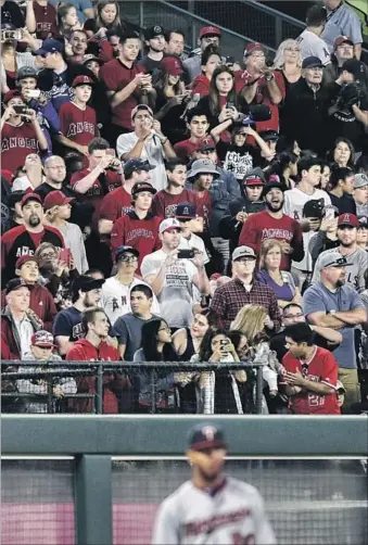  ?? Robert Gauthier Los Angeles Times ?? A SPOT IN THE CHEAP SEATS behind left field at Angel Stadium might pay off big for some lucky fan if he or she catches Albert Pujols’ 600th home run. The ball could fetch a six-figure price at auction.