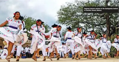  ??  ?? Regional dancers perform at the Guelaguetz­a festival in Zaachila, Oaxaca, Mexico.