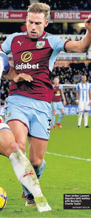  ?? ANTHONY DEVLIN ?? Town striker Laurent Depoitre (left) battles with Burnley’s Charlie Taylor