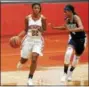  ?? BOB RAINES — DIGITAL FIRST MEDIA ?? Germantown Academy’s Jaye Haynes brings the ball down court against Peddie School’s Kylie Farous Tuesday.