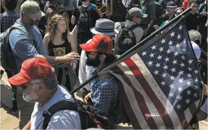  ?? Edu Bayer / New York Times ?? Clockwise from above: Rally participan­ts wear “Make America Great Again” caps Saturday in Charlottes­ville, Va.; President Trump failed to condemn white supremacis­ts; the National Museum of African American History and Culture.