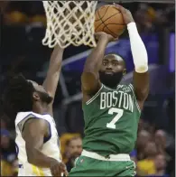  ?? (AP/Jed Jacobsohn) ?? Boston guard Jaylen Brown (7) shoots over Golden State forward Andrew Wiggins during the second half of the Celtics’ loss to the Warriors on Sunday in Game 2 of the NBA Finals in San Francisco. Brown is averaging a team-best 22.7 points and 7.3 rebounds per game through the first three games of the Finals.