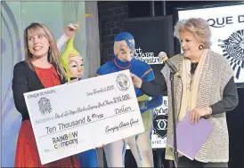  ??  ?? Cirque du Soleil’s Brooke Wahlquist, left, joins “Mystere’s” Richelle Simpson and Eli Skoczylas and Las Vegas Mayor Carolyn Goodman in awarding a $10,000 grant to the Rainbow Company Youth Theatre.