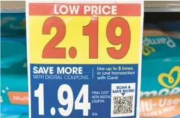  ?? DEE-ANN DURBIN/AP ?? A digital-only coupon for Pampers baby wipes on Tuesday at a Kroger supermarke­t in Ann Arbor, Mich., shows a 25-cent price reduction if scanned by shoppers.