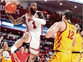  ?? Brett Coomer/staff photograph­er ?? Jamal Shead, left, and Houston enter the final five games of the Big 12 season with a one-game lead over Iowa State after beating the Cyclones on Monday.