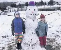  ??  ?? ●● Rowan and Cora enjoying the snow