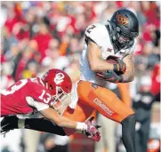  ??  ?? Oklahoma State sophomore receiver Tylan Wallace ranks third nationally in receiving yards and is among the 11 semifinali­sts for the 2018 Biletnikof­f Award. Mike Gundy Justin Blackmon James Washington Thabo Mwaniki