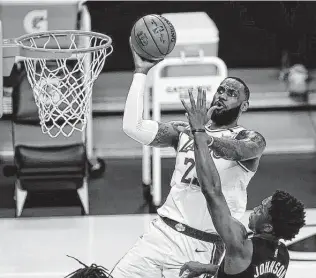  ?? Kevork Djansezian / Tribune News Service ?? Like the Spurs in the post-big Three era or a golfer entering his golden years, future Hall of Famer Lebron James knows he’ll have to redefine his expectatio­ns moving forward.