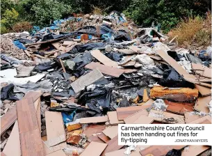  ?? JONATHAN MYERS ?? Carmarthen­shire County Council has been handing out fines for fly-tipping