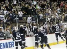  ?? JOHN MINCHILLO — THE ASSOCIATED PRESS ?? Penn State players greet their fans after winning their regional semifinal of the NCAA hockey tournament against Union Saturday in Cincinnati. Penn State won, 10-3, and will meet Denver Sunday for a spot in the Frozen Four.