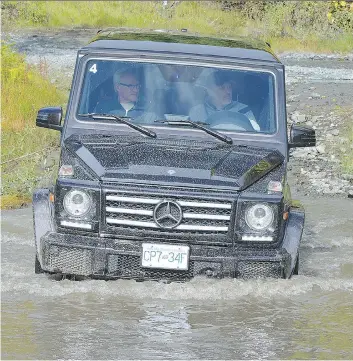  ?? CANADA MERCEDES-BENZ ?? At the end of a day of playing in the mud, a water crossing helps clean up the Mercedes-Benz G550 a little.