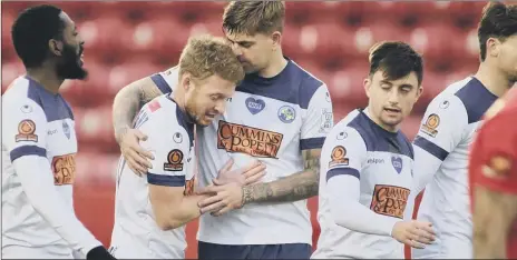  ??  ?? YOU BEAUTY! Tommy Wright, second left, is congratula­ted by Sam Magri after scoring his first goal at Ebbsfleet