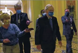  ?? SUSAN WALSH — THE ASSOCIATED PRESS ?? Senate Majority Leader Mitch McConnell walks past reporters on Capitol Hill in Washington on Tuesday.