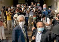  ?? AP ?? Pro-democracy lawmaker Martin Lee, left, and Albert Ho, right, arrive at a court in Hong Kong.