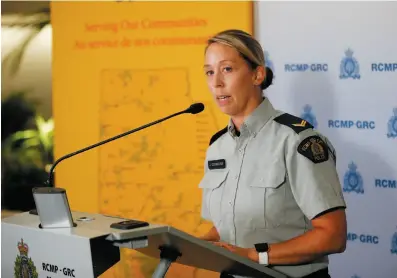  ?? CP PHOTO ?? RCMP Cpl. Julie Courchaine speaks to media about the ongoing RCMP search in Northern Manitoba for the B.C. murder suspects in Winnipeg on Monday.