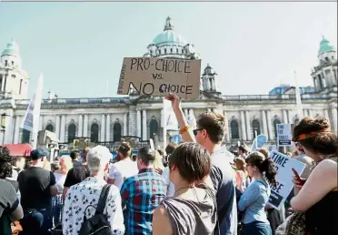  ?? — AFP ?? Calling for change: Pro-choice protesters holding placards during a demonstrat­ion calling for abortion to be legalised in Northern Ireland, outside Belfast city hall.