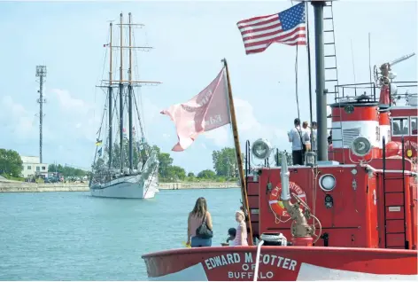  ?? MICHELLE ALLENBERG/WELLAND TRIBUNE ?? People aboard the Edward M Cotter of Buffalo watch as Empire Sandy enters the Welland Canal Sunday afternoon.