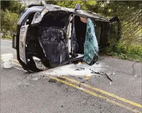  ?? Brookfield Volunteer Fire Company / Contribute­d photo ?? The scene of vehicle rollover on Oak Grove Road in Brookfield on Thursday afternoon resulted in minor injuries.