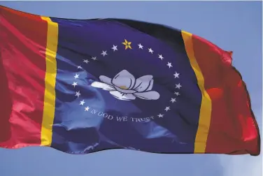  ?? Rogelio V. Solis / Associated Press 2020 ?? Mississipp­i hoisted a new state flag without the Confederat­e battle emblem this week, just over six months after legislator­s retired the last state banner in the U. S. that included the divisive rebel symbol.