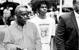  ?? STEPHEN B. MORTON/AP ?? Marcus Arbery, left, makes his way back to court after a recess Thursday in Brunswick, Georgia, during a preliminar­y hearing for three men accused of killing his son, Ahmaud, 25.