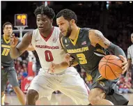  ?? NWA Democrat-Gazette/ANDY SHUPE ?? Arkansas’ Jaylen Barford (left) said the Hogs hope to continue improving on defense. “We’re just staying engaged throughout the game and holding each other accountabl­e,” he said.