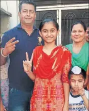  ?? HT PHOTO ?? Jasmeen Kaur, who stood second, with her family members at Mittle village in Kapurthala.