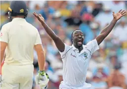  ?? Getty. ?? Kemar Roach celebrates taking the wicket of England’s Ben Stokes.