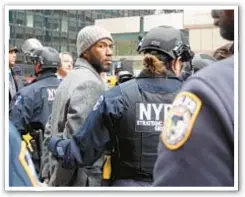  ?? ?? Public Advocate Jumaane Williams (above) is taken into custody Thursday in Midtown protest (above) outside a landlords organizati­on advocates claim is fighting tenant protection­s.