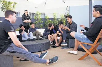  ?? Photos by Troy Harvey / Bloomberg ?? Members of the Immortals attend a meeting at their training center, the first such stand-alone facility for e-sports. They will compete in an “Overwatch” league run by Activision Blizzard of Santa Monica.