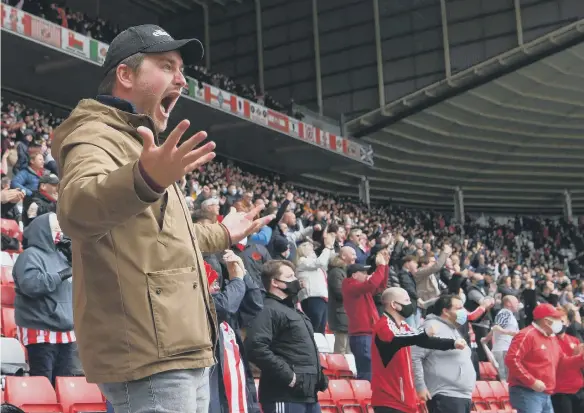  ??  ?? A Wearsider celebrates after the first Sunderland goal during the League One Play-off semi-final second-leg match between the Black Cats and Lincoln City at Stadium of Light.