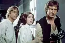  ??  ?? 1977
Mark Hamill, Carrie Fisher e Harrison Ford nel primo capitolo della saga scritta e diretta da George Lucas