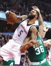  ?? Associated Press ?? Washington Wizards forward Markieff Morris (5) grabs a rebound over Boston Celtics guard Marcus Smart (36) during Washington’s 92-91 win in Game 6 of the Eastern Conference semifinals.