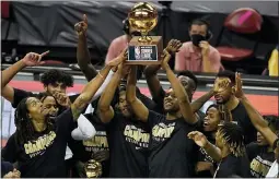  ?? JOHN LOCHER — THE ASSOCIATED PRESS ?? Sacramento Kings players hold up the trophy after defeating the Boston Celtics in the NBA summer league championsh­ip basketball game Tuesday, Aug. 17, 2021, in Las Vegas.