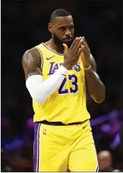  ?? RONALD MARTINEZ — GETTY IMAGES ?? The Lakers' LeBron James had team-highs of 31 points and 13assists but couldn't prevent Sacramento from winning.