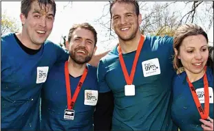  ??  ?? Fit for anything: James Smith (second right) with colleagues from The Gym