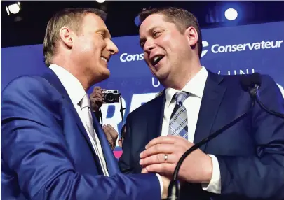  ??  ?? above
Andrew Scheer, right, and Maxime Bernier at the Conservati­ve Party’s leadership convention in 2017