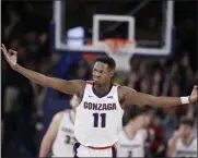  ?? YOUNG KWAK - THE ASSOCIATED PRESS ?? Gonzaga guard Joel Ayayi (11) gestures after scoring a basket during the second half of the team’s NCAA college basketball game against Saint Mary’s in Spokane, Wash., Saturday, Feb. 29, 2020. Gonzaga won 86-76.