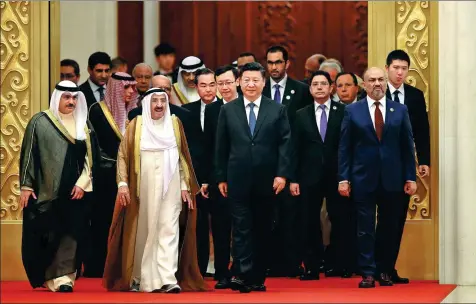  ?? FENG YONGBIN / CHINA DAILY ?? President Xi Jinping and guests enter the Great Hall of the People in Beijing for the opening ceremony of the eighth ministeria­l meeting of the China-Arab States Cooperatio­n Forum on Tuesday morning. Xi said China and Arab countries should promote vitalizati­on in the Middle East.