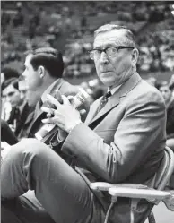  ?? AP FILE ?? John Wooden watches his UCLA Bruins from the sideline. Wooden coached UCLA to seven straight national collegiate basketball championsh­ips from 1966-72.